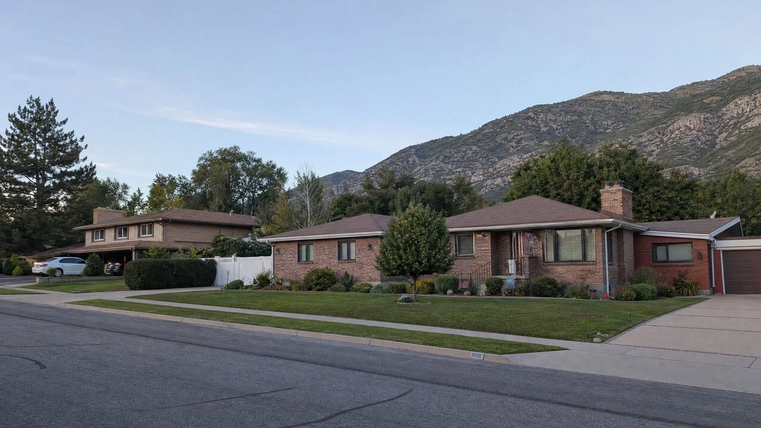 Established street at the base of the foothills with a home that has a matching side addition